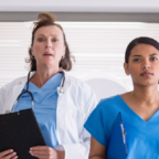 Medical staff walking speedily through corridor